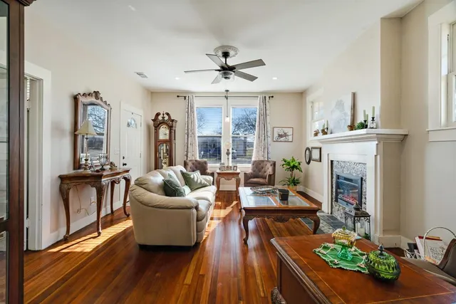 a living room with furniture and a fireplace