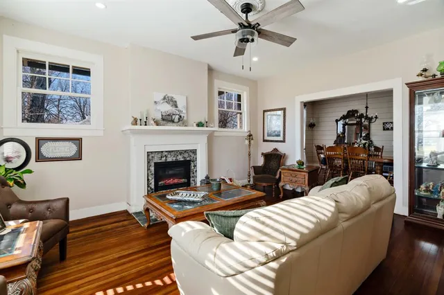 a living room with furniture and a fireplace