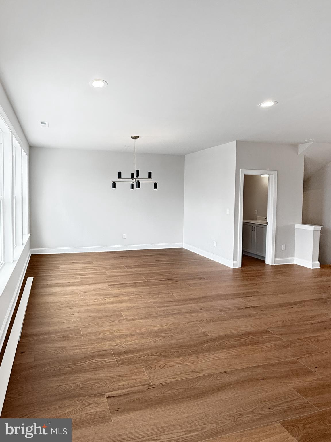 3 Schadle Road Perkasie, PA 18944 - Photo 16 of 40 a view of an empty room with wooden floor and a window
