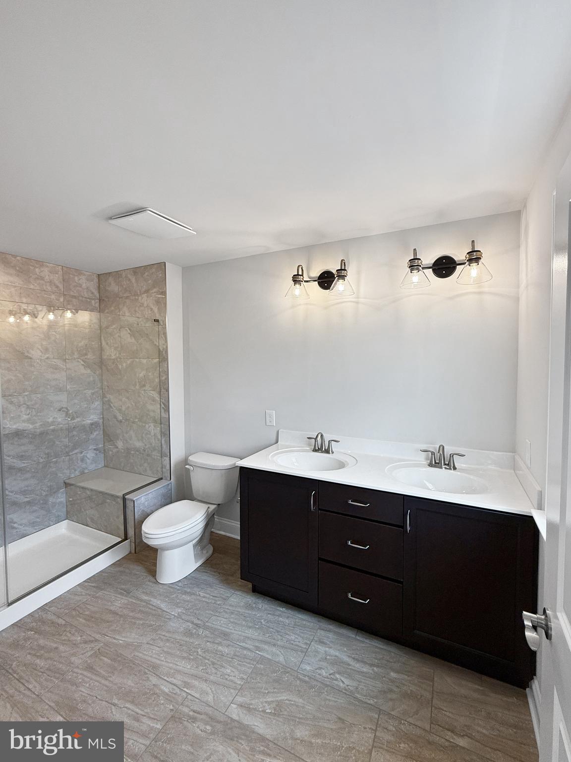 3 Schadle Road Perkasie, PA 18944 - Photo 23 of 40 a spacious bathroom with a double vanity sink toilet and shower