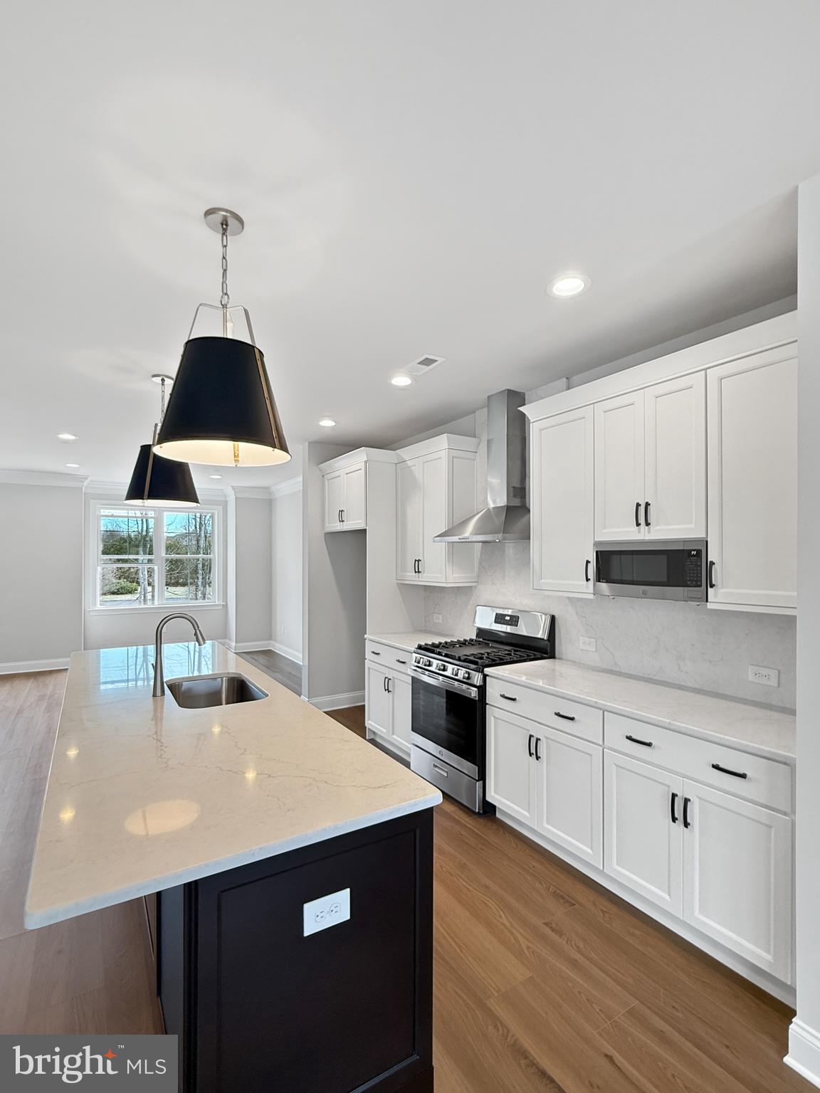 3 Schadle Road Perkasie, PA 18944 - Photo 7 of 40 a kitchen with stainless steel appliances a sink a stove a refrigerator white cabinets and wooden floor