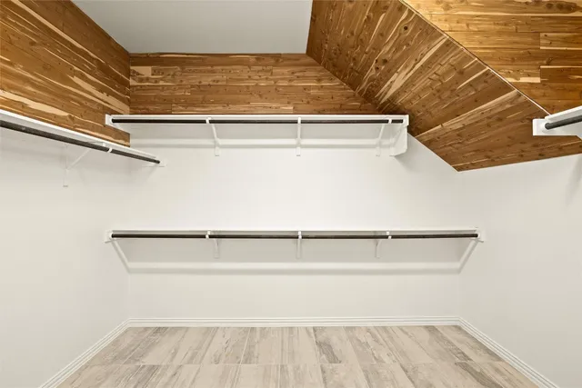 a bathroom with a sink a toilet and a large mirror