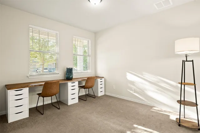 a kitchen with stainless steel appliances granite countertop a sink a stove and a wooden floor