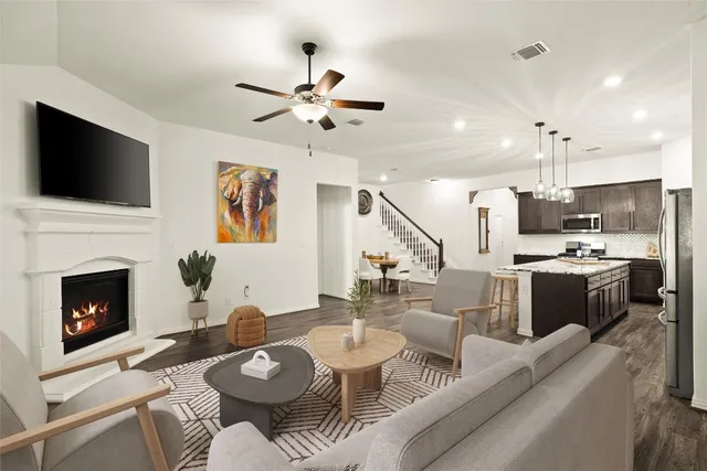 a spacious bedroom with a bed and a couch