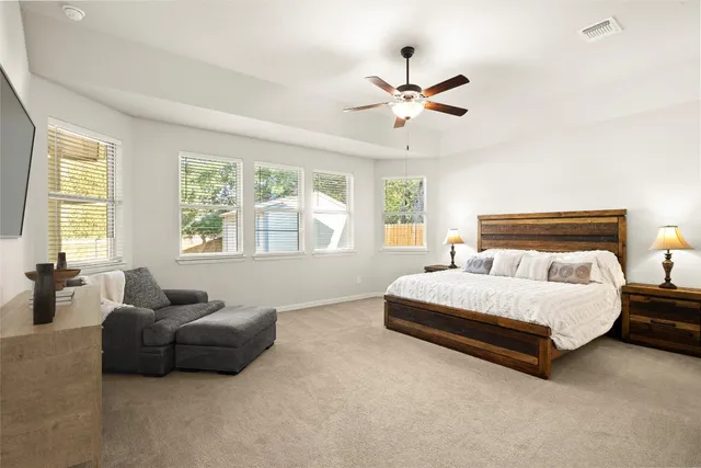 a kitchen with stainless steel appliances kitchen island granite countertop a stove a sink and a refrigerator