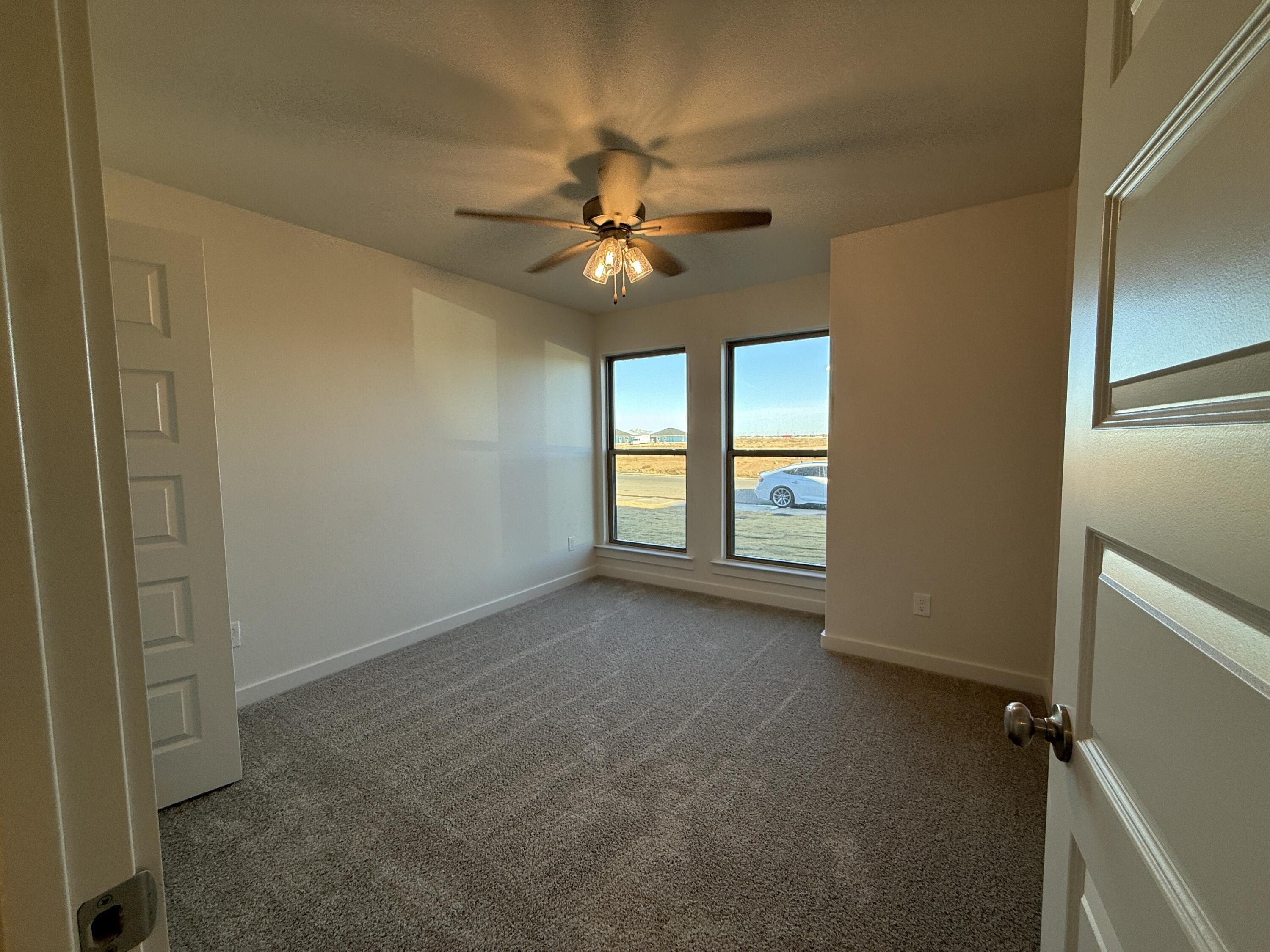 3003 138th Place Lubbock, TX 79423 - Photo 13 of 14 a view of an empty room with a window