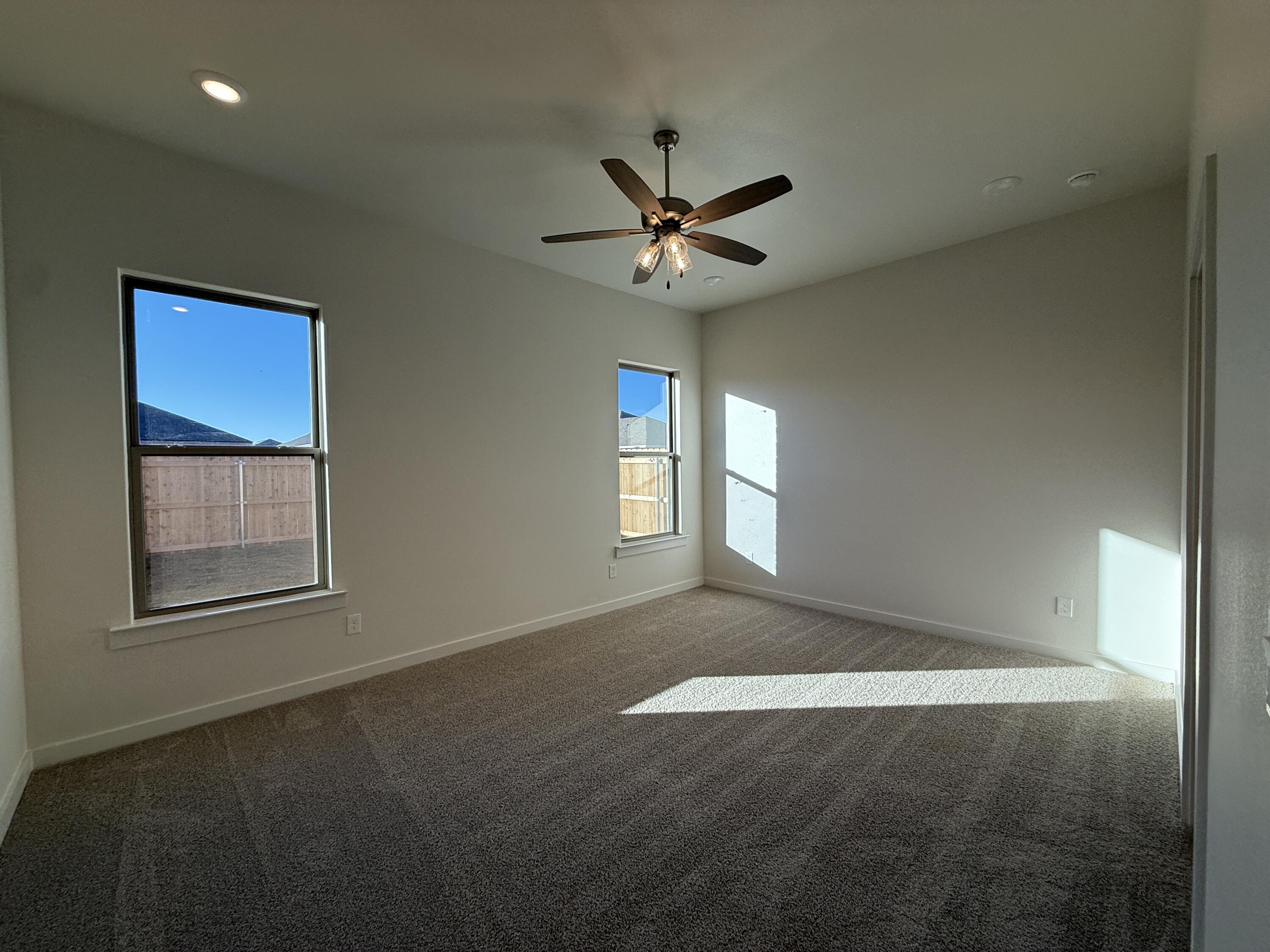 3003 138th Place Lubbock, TX 79423 - Photo 6 of 14 a view of an empty room with a window