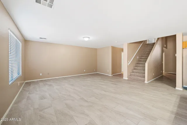 a view of a livingroom with a kitchen