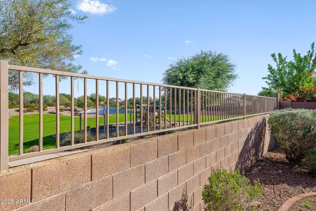 a view of a backyard with potted plants