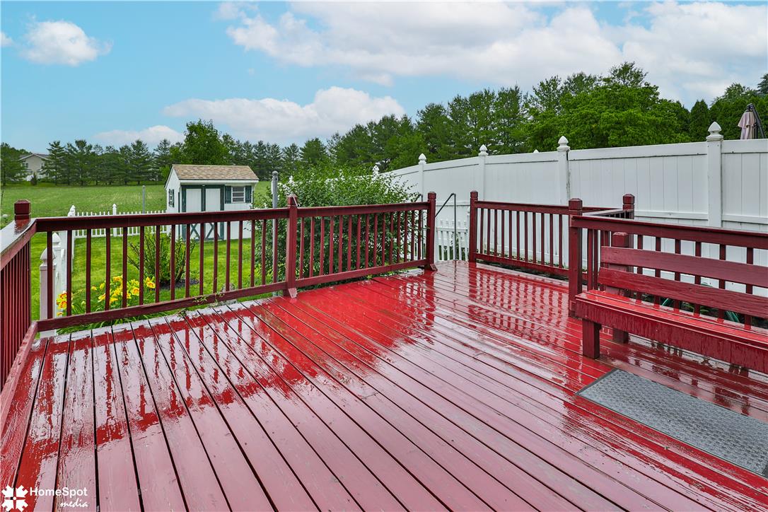 507 Howertown Road Northampton, PA 18067 - Photo 37 of 46 A spacious red wood deck with integrated seating offers serene backyard views.