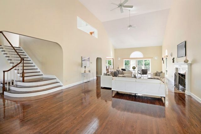 a view of living room with furniture and fireplace