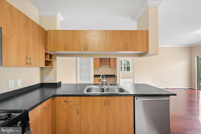 a kitchen with a sink and a refrigerator