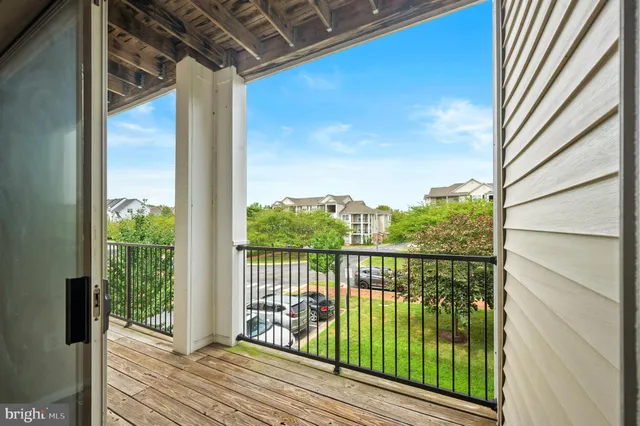 a view of a balcony with wooden floor