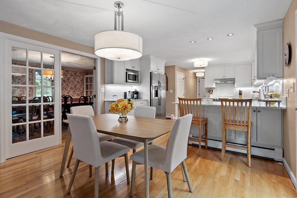 318 Reed Farm Road Boxborough, MA 01719 - Photo 14 of 42 a dining room with furniture and wooden floor