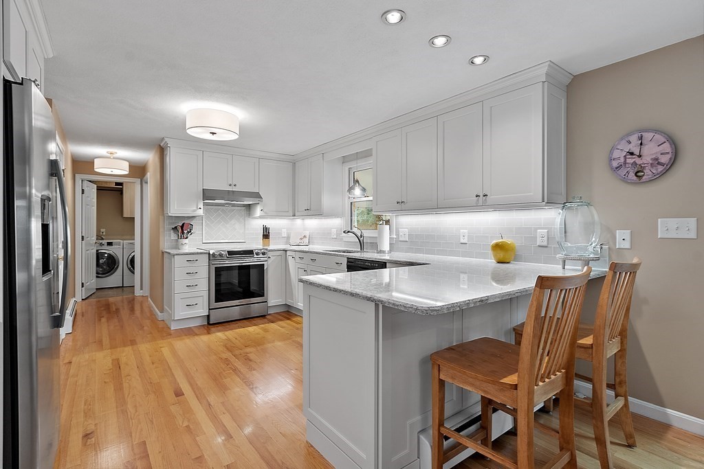 318 Reed Farm Road Boxborough, MA 01719 - Photo 15 of 42 a kitchen with a sink cabinets and window