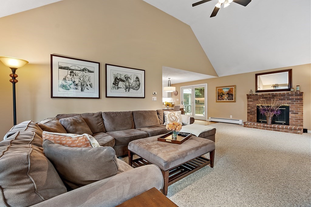 318 Reed Farm Road Boxborough, MA 01719 - Photo 18 of 42 a living room with furniture and a fireplace