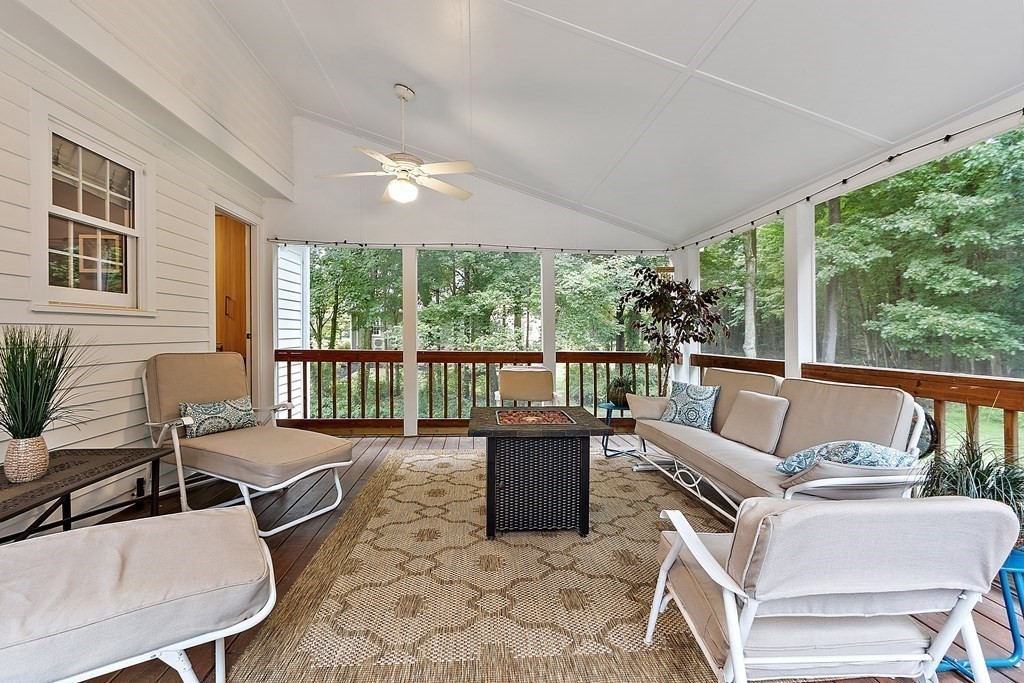 318 Reed Farm Road Boxborough, MA 01719 - Photo 23 of 42 a living room with furniture and large windows