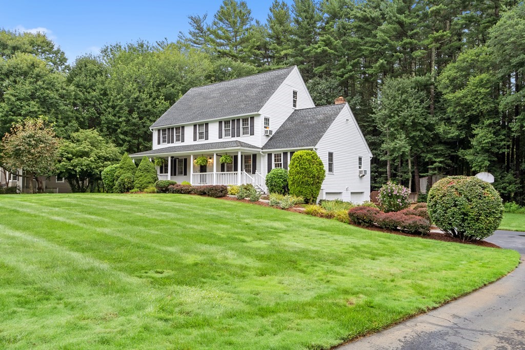 318 Reed Farm Road Boxborough, MA 01719 - Photo 3 of 42 a aerial view of a house with a yard table and chairs