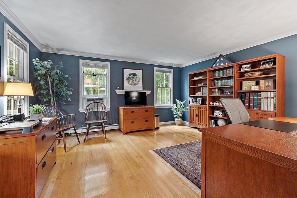 318 Reed Farm Road Boxborough, MA 01719 - Photo 8 of 42 a view of a livingroom with furniture and a flat screen tv