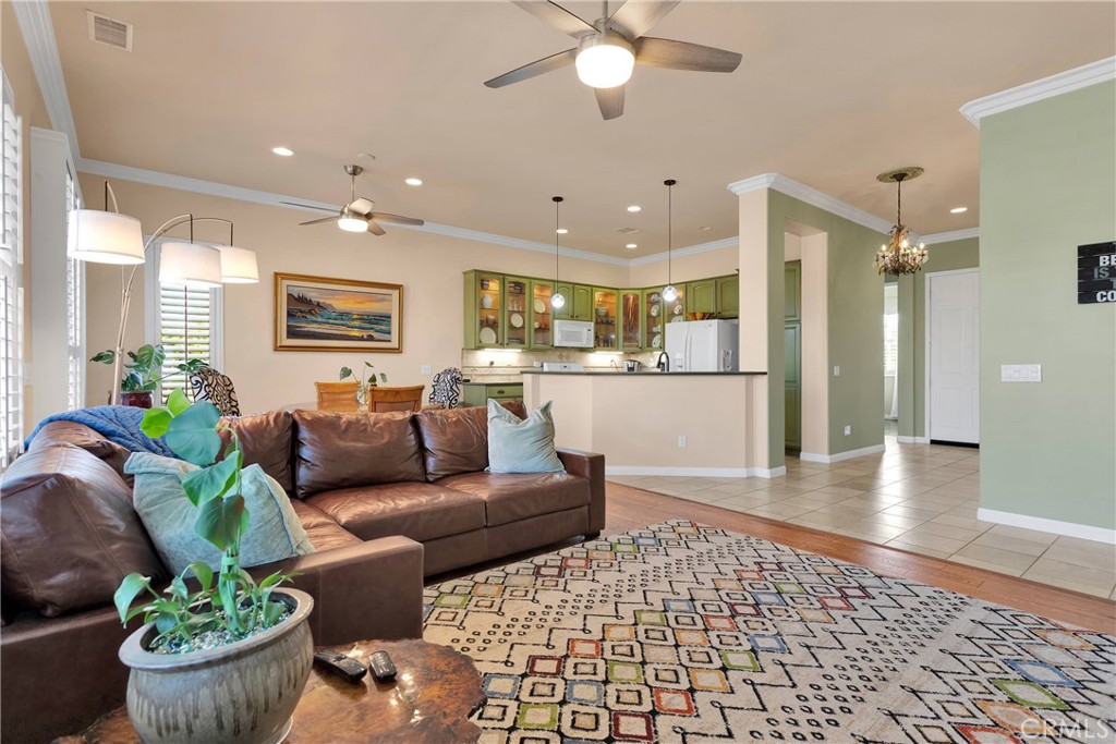 10686 Archerwill Road Apple Valley, CA 92308 - Photo 12 of 55 a living room with furniture and a view of kitchen