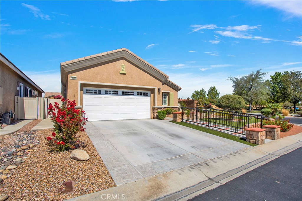 10686 Archerwill Road Apple Valley, CA 92308 - Photo 2 of 55 a front view of a house with garden
