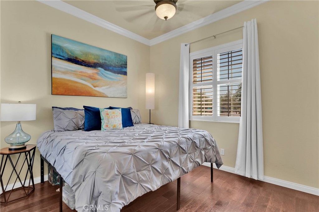 10686 Archerwill Road Apple Valley, CA 92308 - Photo 23 of 55 a bedroom with a bed and painting on the wall