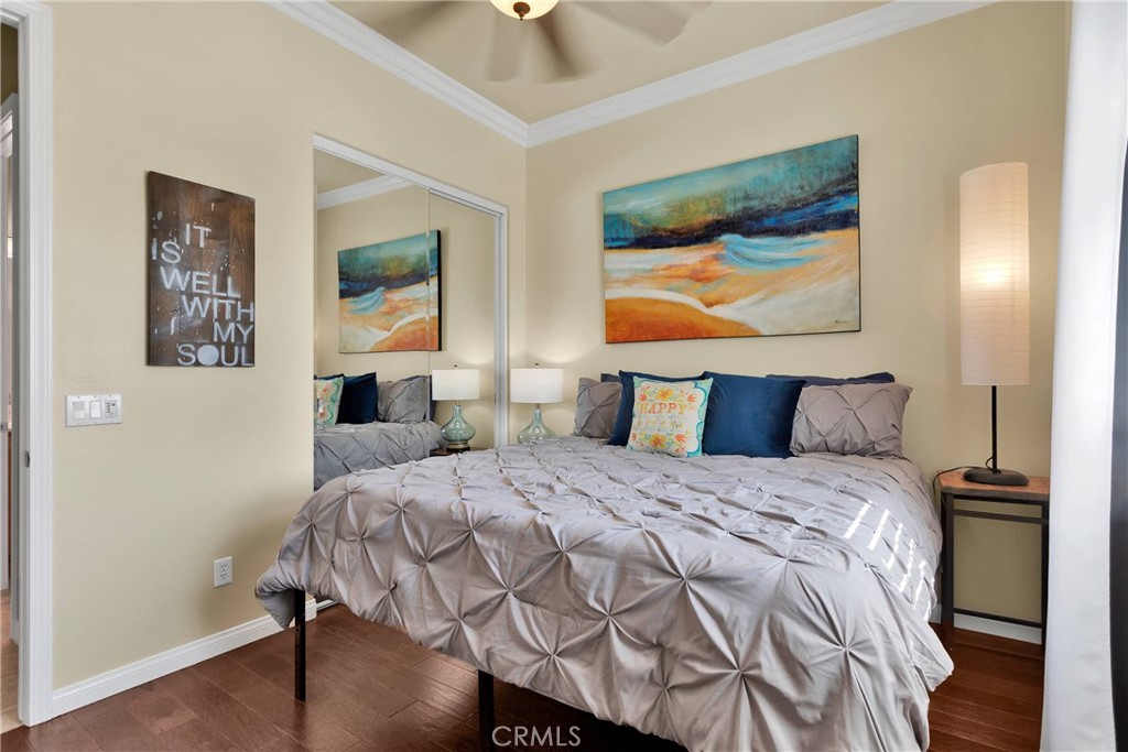 10686 Archerwill Road Apple Valley, CA 92308 - Photo 24 of 55 a bedroom with a bed and a painting on the wall