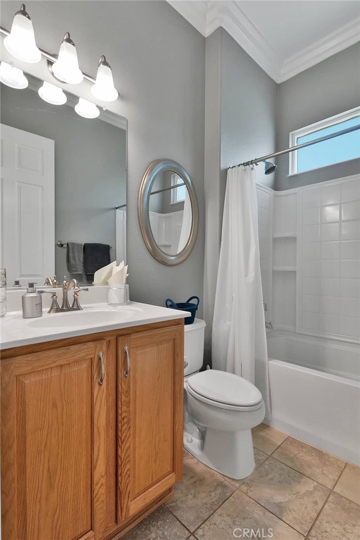 10686 Archerwill Road Apple Valley, CA 92308 - Photo 26 of 55 a bathroom with a sink a toilet and a large mirror