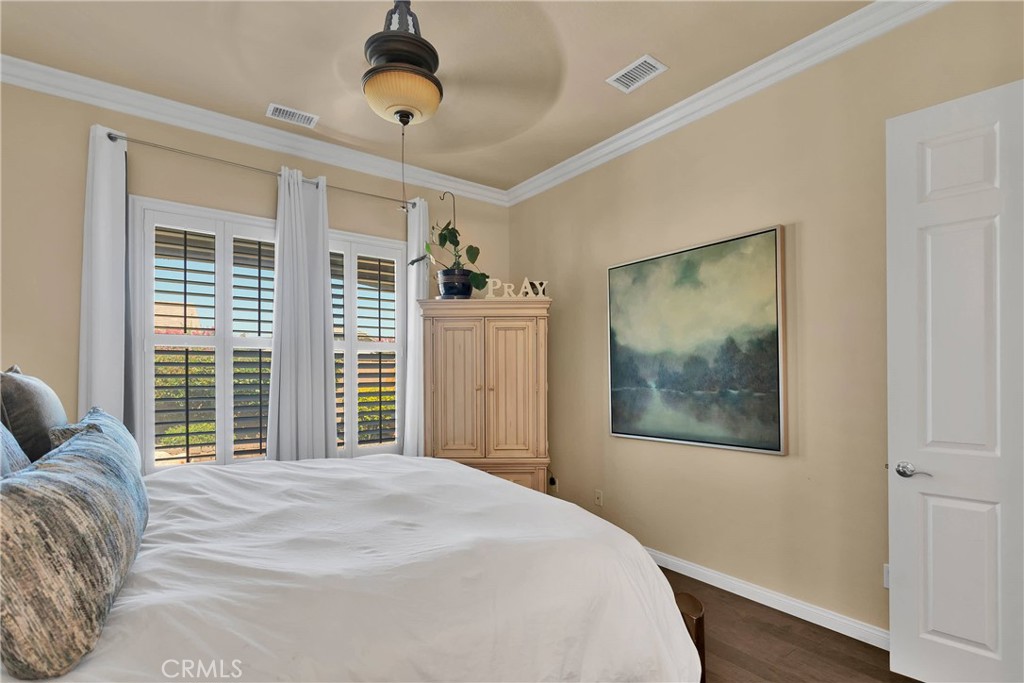 10686 Archerwill Road Apple Valley, CA 92308 - Photo 29 of 55 a bedroom with a large bed and a window
