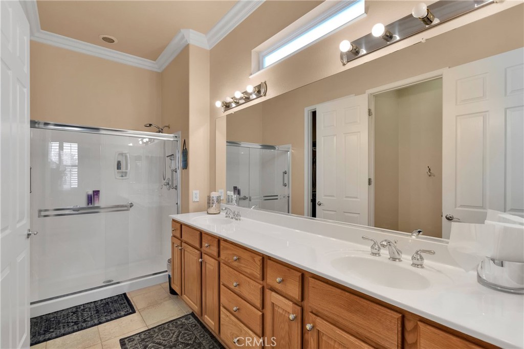 10686 Archerwill Road Apple Valley, CA 92308 - Photo 30 of 55 a spacious bathroom with double vanity and a mirror