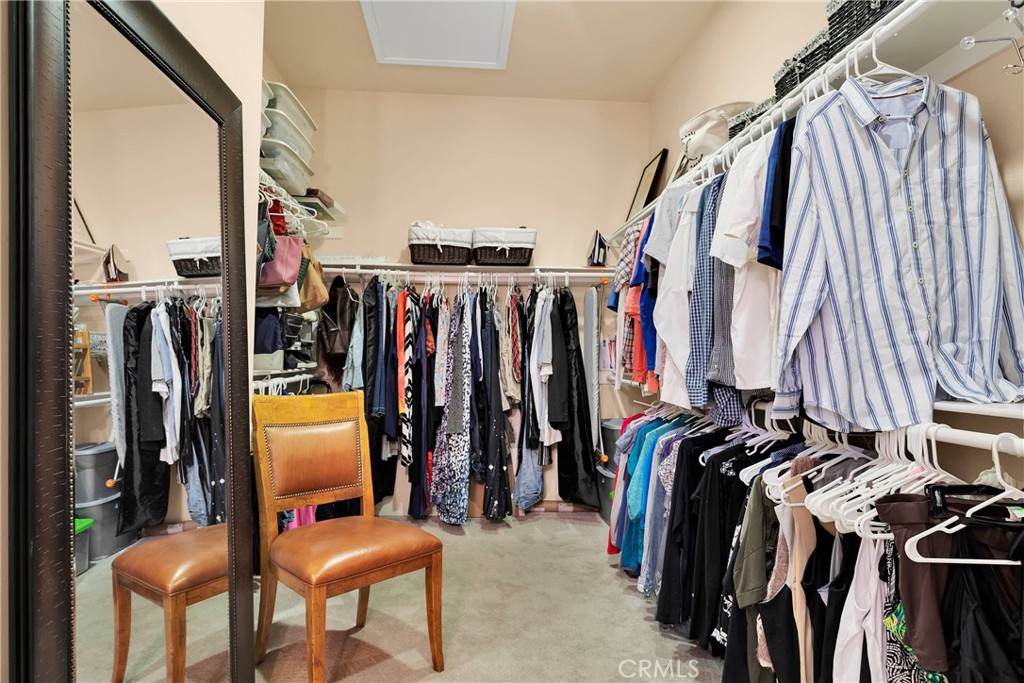 10686 Archerwill Road Apple Valley, CA 92308 - Photo 33 of 55 a view of walk in closet with clothes and shoes
