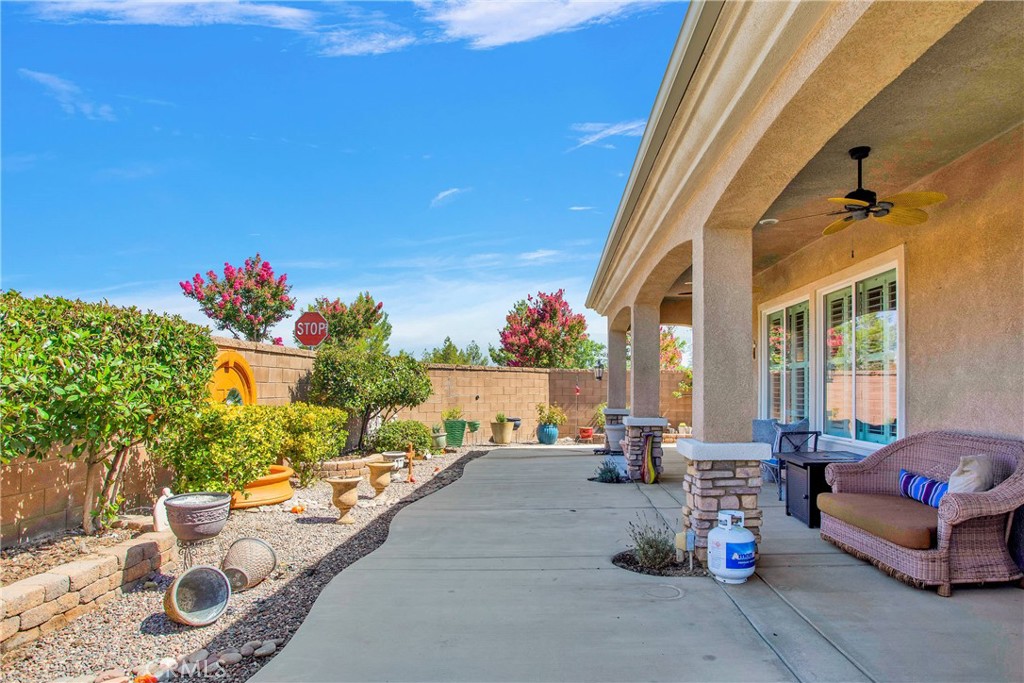 10686 Archerwill Road Apple Valley, CA 92308 - Photo 37 of 55 a building outdoor space with patio furniture and potted plants