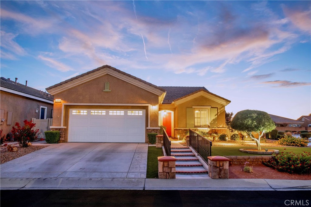 10686 Archerwill Road Apple Valley, CA 92308 - Photo 43 of 55 a front view of a house with garden