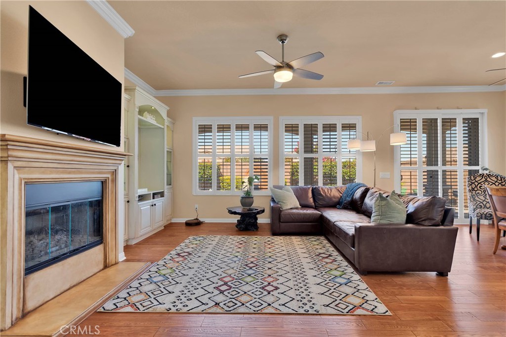 10686 Archerwill Road Apple Valley, CA 92308 - Photo 9 of 55 a living room with furniture tv and a fireplace