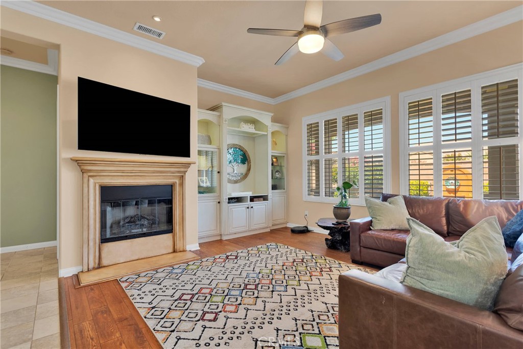 10686 Archerwill Road Apple Valley, CA 92308 - Photo 10 of 55 a living room with furniture and a fireplace