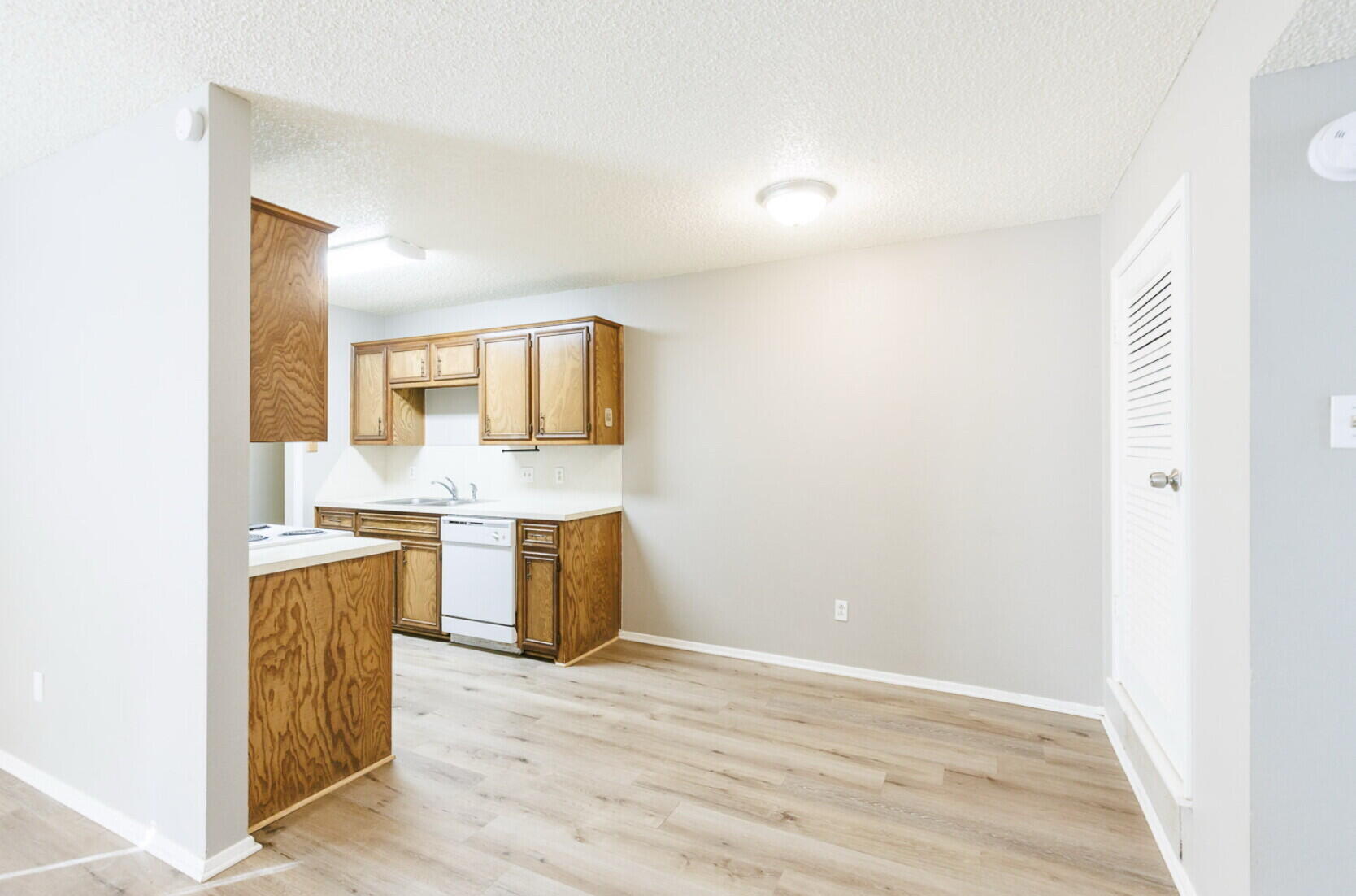 6112 38th Street, Unit A Lubbock, TX 79407 - Photo 5 of 15 a view of a kitchen with a sink and a stove