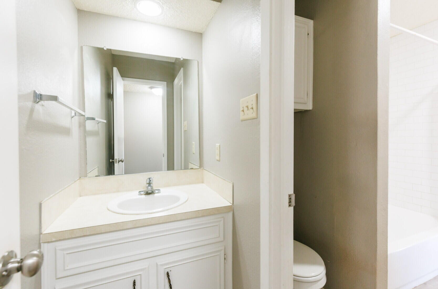 6112 38th Street, Unit A Lubbock, TX 79407 - Photo 10 of 15 a bathroom with a sink toilet and shower