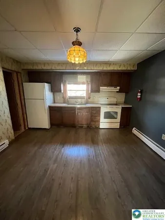 a view of kitchen and wooden floor
