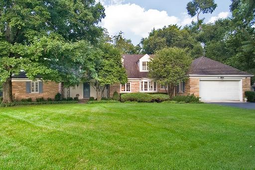 164 Spring Lane Winnetka, IL 60093 - Photo 1 of 1 a front view of a house with a garden