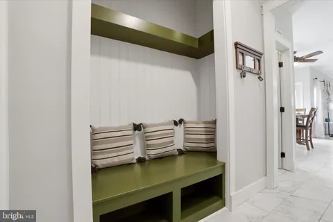 a bathroom with a sink vanity and a mirror