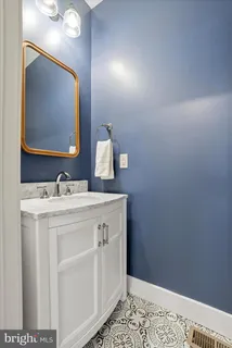 a bedroom with bed couch and window