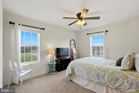 a view of a livingroom with furniture and a flat screen tv