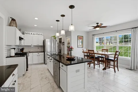 a kitchen with counter top space cabinets and stainless steel appliances