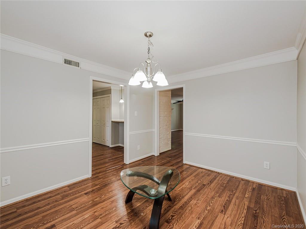 1708 Roxborough Road Charlotte, NC 28211 - Photo 14 of 27 a view of a livingroom with wooden floor and a ceiling fan