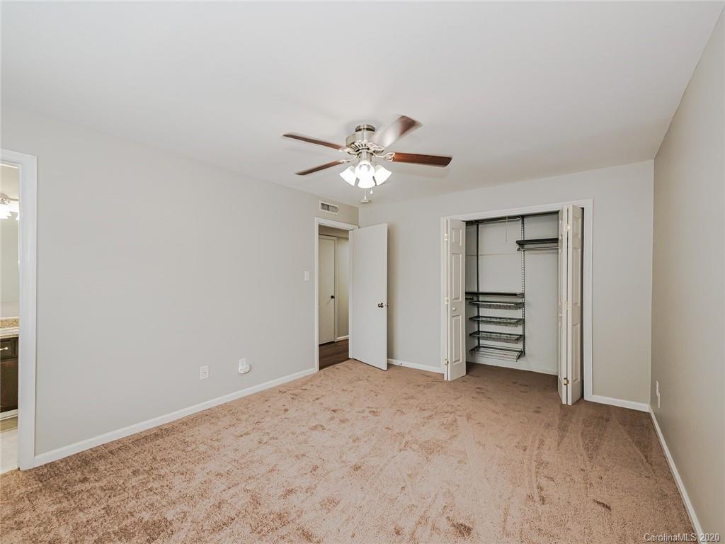 1708 Roxborough Road Charlotte, NC 28211 - Photo 22 of 27 a view of an empty room with a ceiling fan