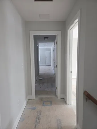 a view of a kitchen with sink cabinets and wooden floor