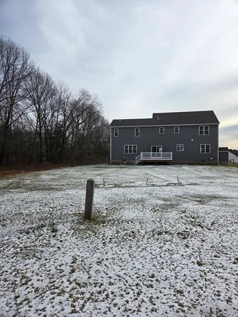a large kitchen with stainless steel appliances granite countertop a stove a sink dishwasher and a refrigerator