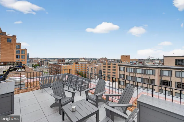 a view of a balcony with chairs