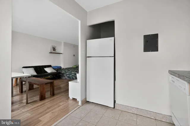 a kitchen with stainless steel appliances a refrigerator and a stove top oven