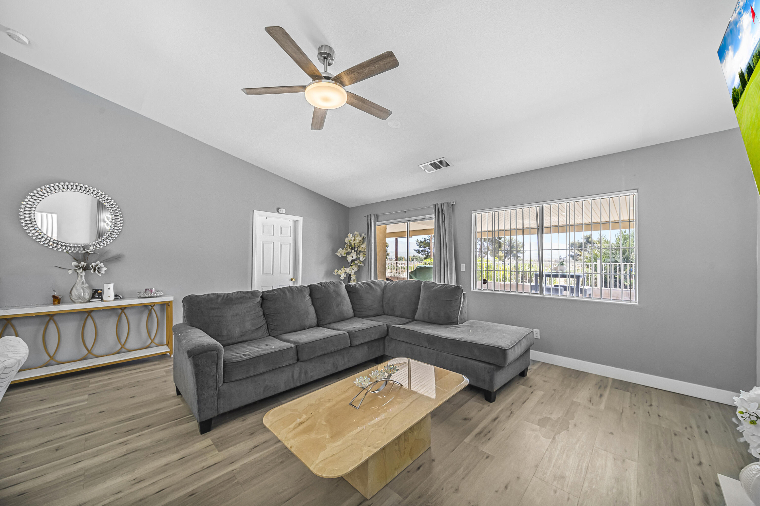33860 Bell Road Thousand Palms, CA 92276 - Photo 13 of 56 a living room with furniture and a large window